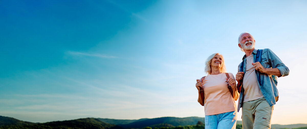 Family smiling outdoors — Totally Smiles dental care